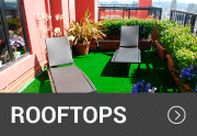 artificial grass rooftop with a sitting area